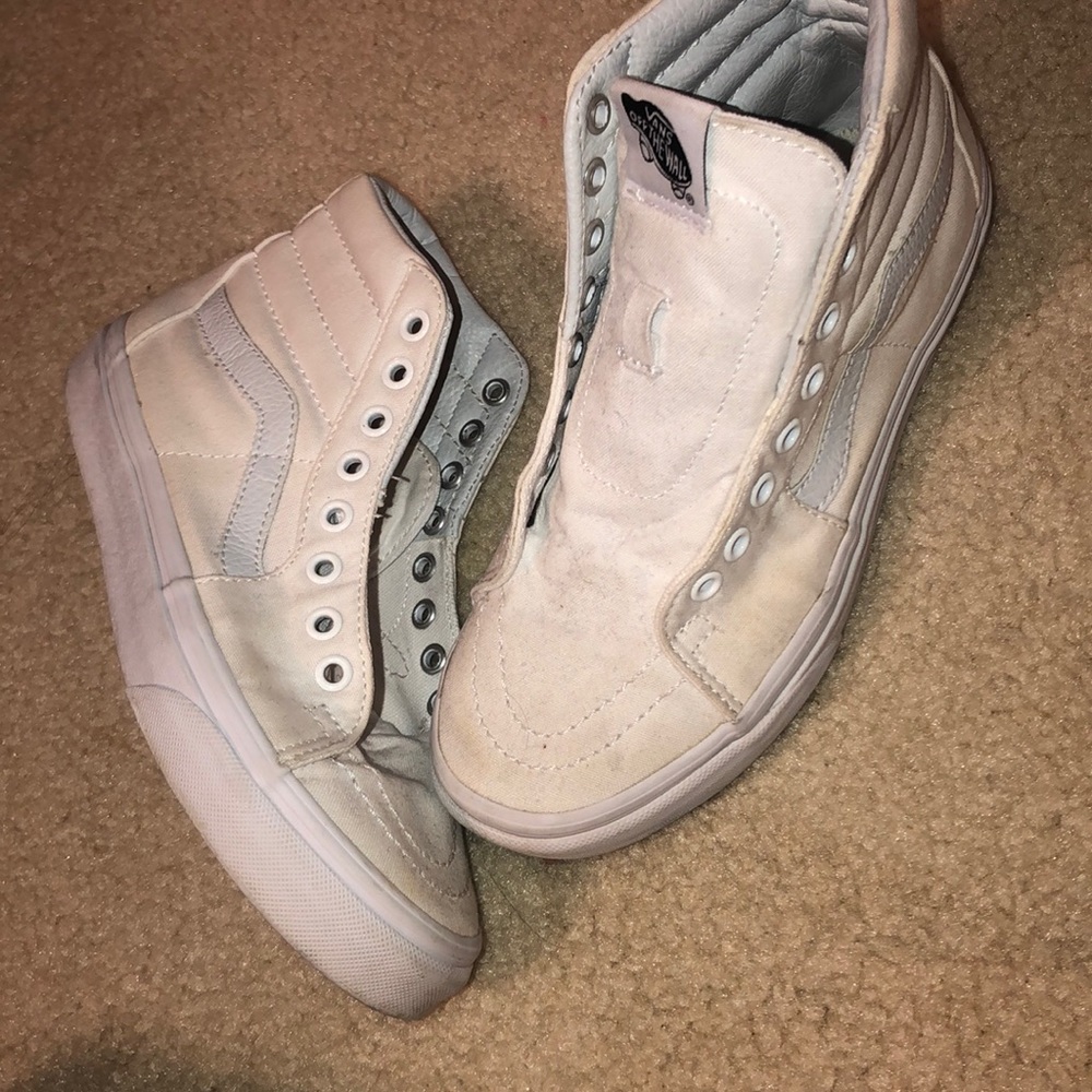 white high top VANS with no laces.